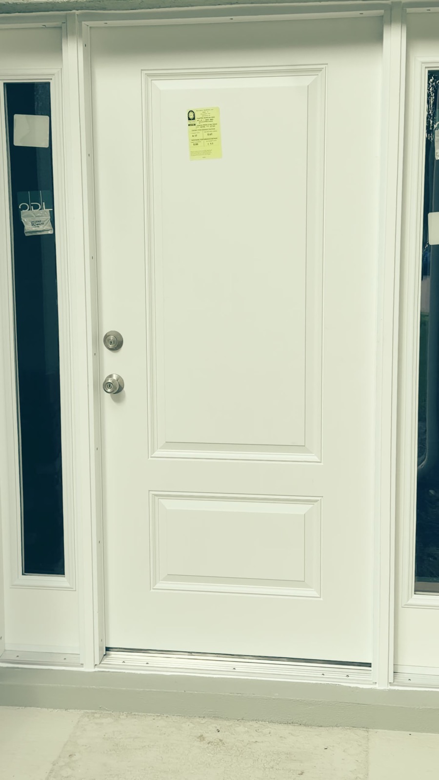 Finished white entry door installed by Mount Dora Windows